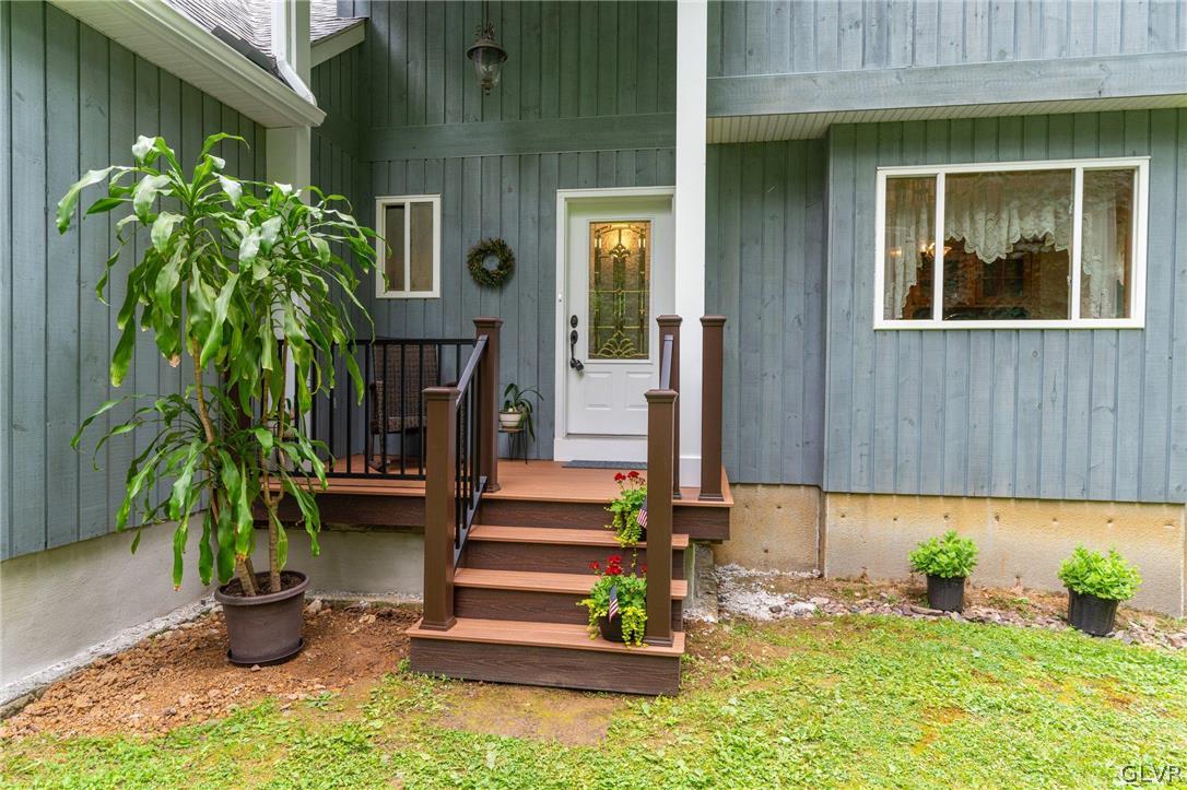 3220 Winding Road Kintnersville, PA 18930 - Photo 3 of 50 a front view of a house with plants