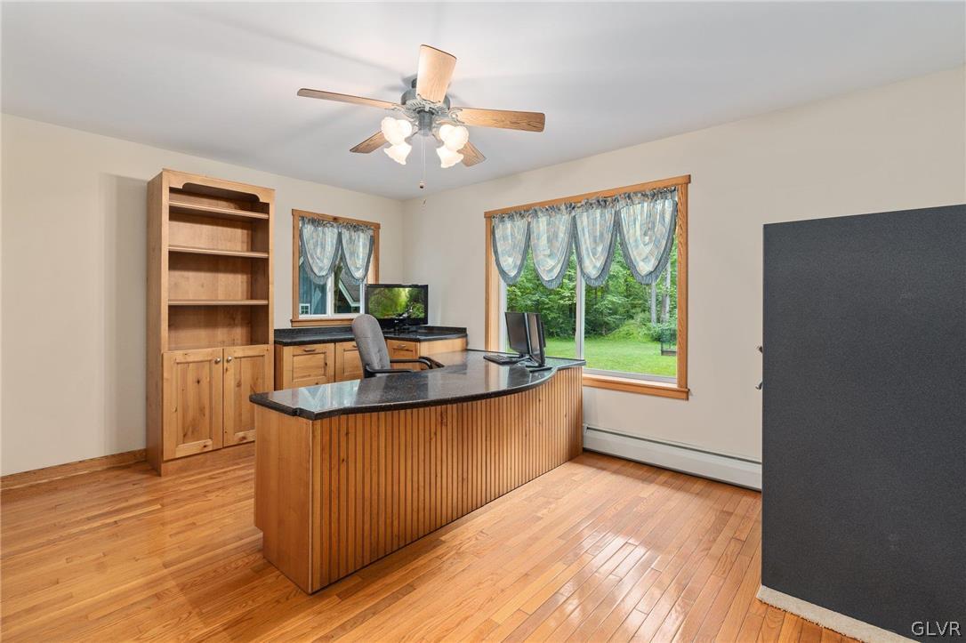 3220 Winding Road Kintnersville, PA 18930 - Photo 31 of 50 a view of a kitchen with kitchen island a large window a sink and stainless steel appliances