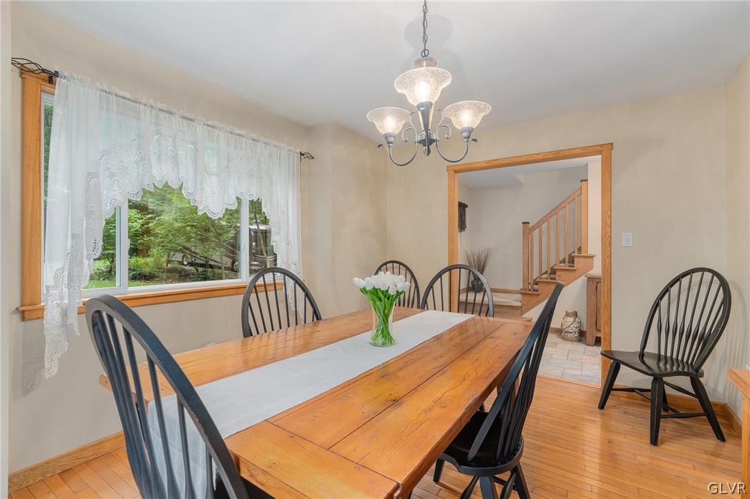 3220 Winding Road Kintnersville, PA 18930 - Photo 33 of 50 a view of a dining room with furniture window and wooden floor