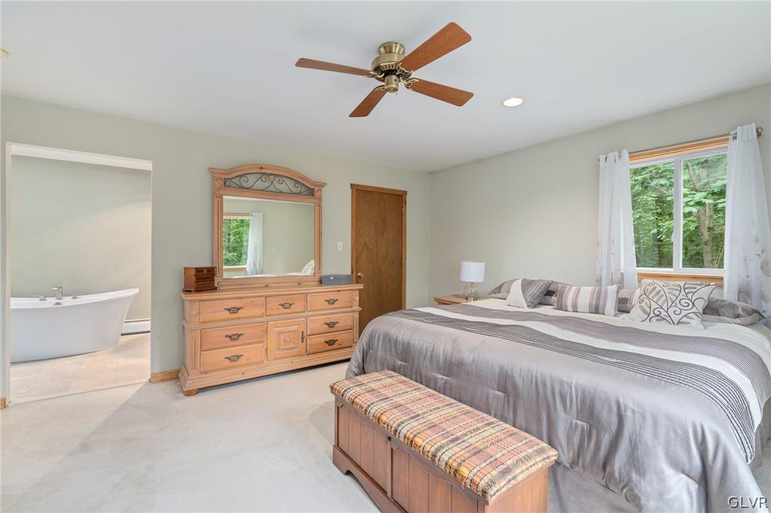 3220 Winding Road Kintnersville, PA 18930 - Photo 44 of 50 a bedroom with a bed and a dresser