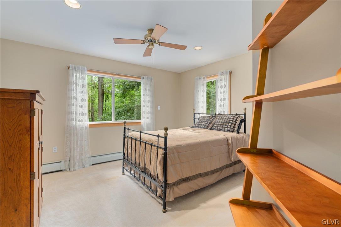 3220 Winding Road Kintnersville, PA 18930 - Photo 48 of 50 a bed sitting in a spacious bedroom next to a window