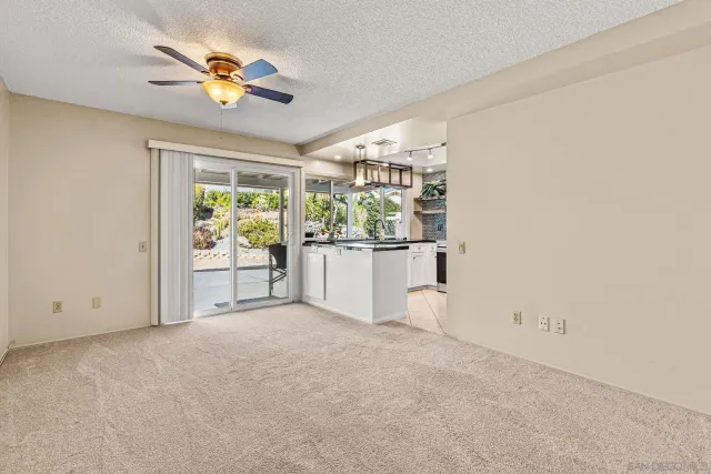 an empty room with windows and painted walls