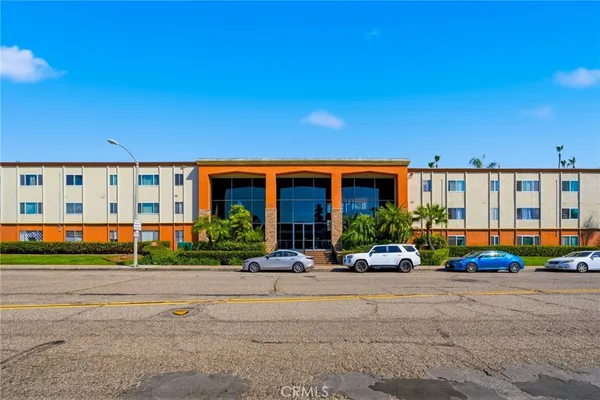 a front view of building with yard