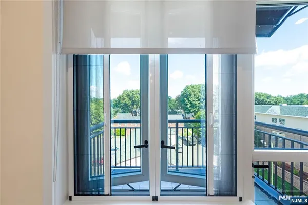 a view of a room that has a large window