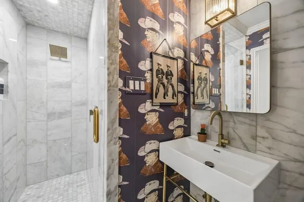 a bathroom with a sink and mirror