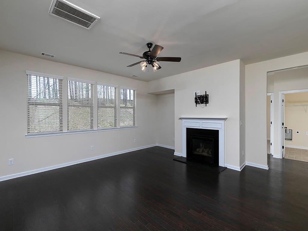 488 Victoria Heights Dr. Dallas, GA 30132 - Photo 12 of 45 a view of empty room with wooden floor and fireplace