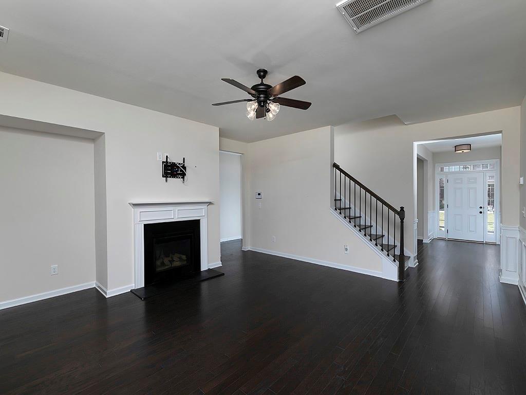488 Victoria Heights Dr. Dallas, GA 30132 - Photo 14 of 45 a view of an empty room with wooden floor fireplace and a window