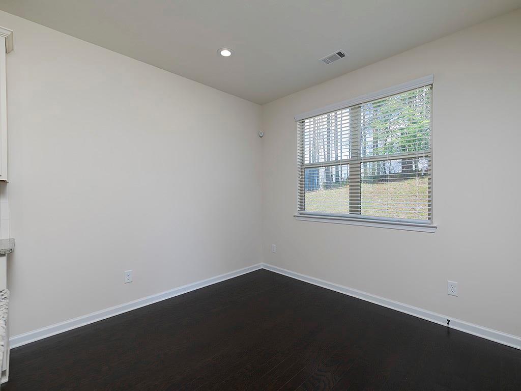 488 Victoria Heights Dr. Dallas, GA 30132 - Photo 19 of 45 a view of an empty room with wooden floor and a window