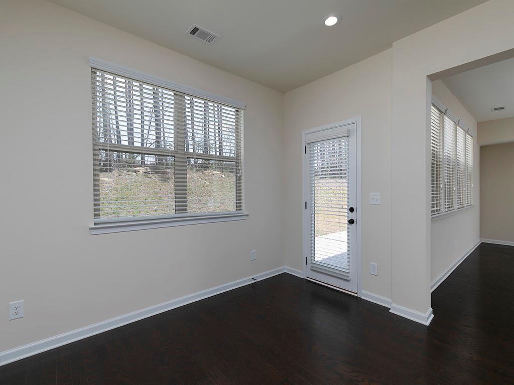 488 Victoria Heights Dr. Dallas, GA 30132 - Photo 20 of 45 a view of an empty room with wooden floor and a window