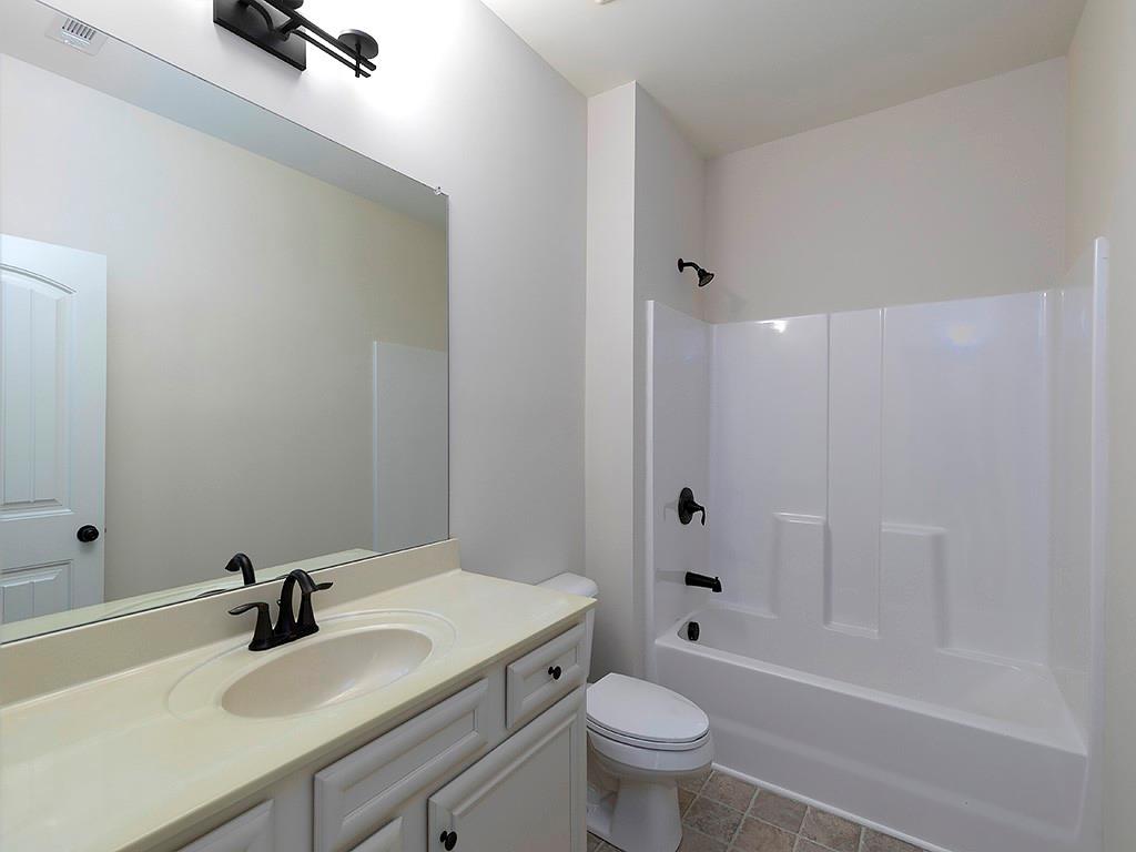 488 Victoria Heights Dr. Dallas, GA 30132 - Photo 21 of 45 a bathroom with a sink a toilet and shower