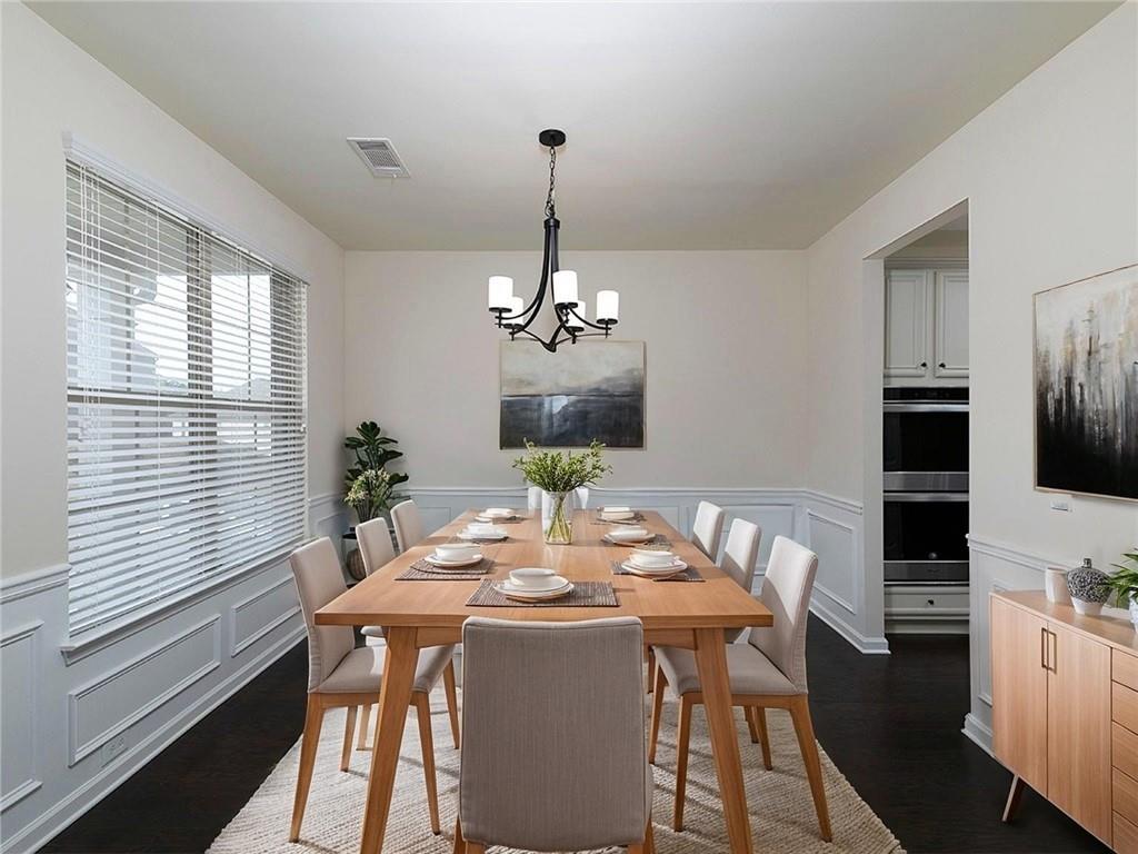 488 Victoria Heights Dr. Dallas, GA 30132 - Photo 3 of 45 a dining room with furniture a chandelier and window