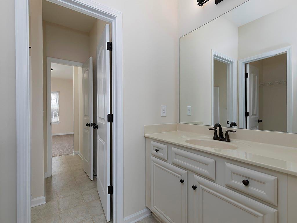 488 Victoria Heights Dr. Dallas, GA 30132 - Photo 36 of 45 a bathroom with a sink and a mirror