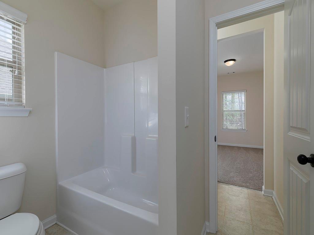 488 Victoria Heights Dr. Dallas, GA 30132 - Photo 37 of 45 a bathroom with a bathtub and toilet