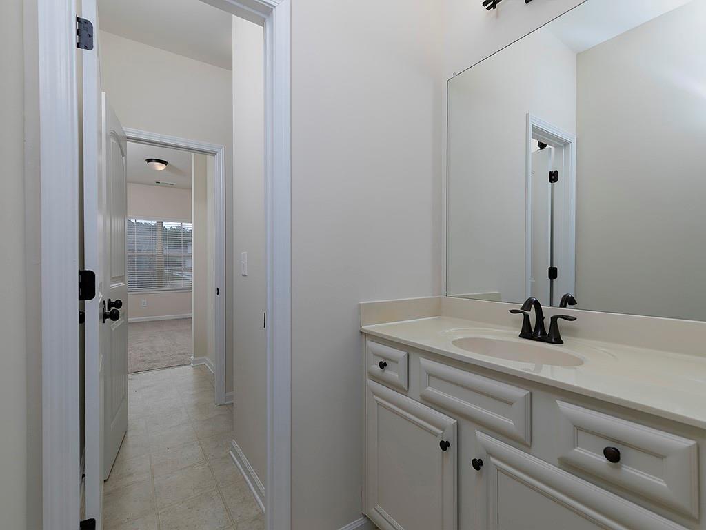 488 Victoria Heights Dr. Dallas, GA 30132 - Photo 39 of 45 a bathroom with a sink and a mirror