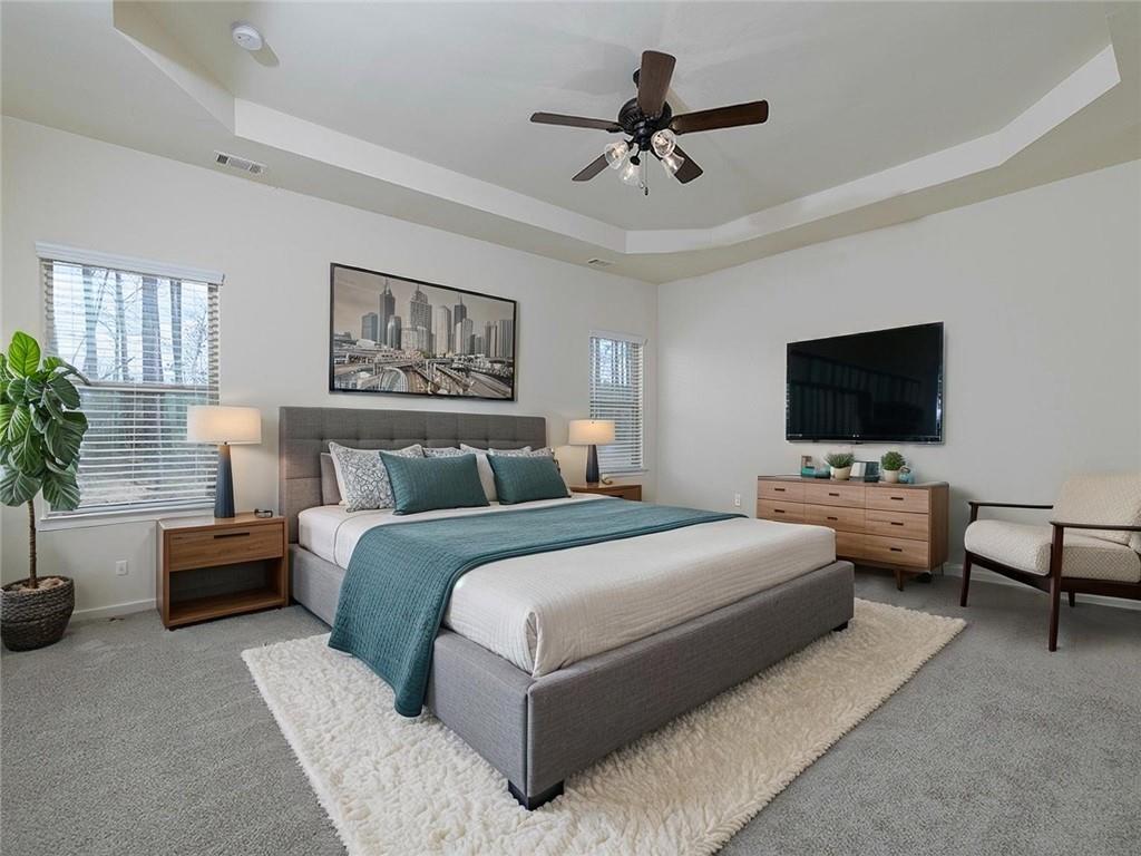 488 Victoria Heights Dr. Dallas, GA 30132 - Photo 5 of 45 a bedroom with a bed couch tv and a window