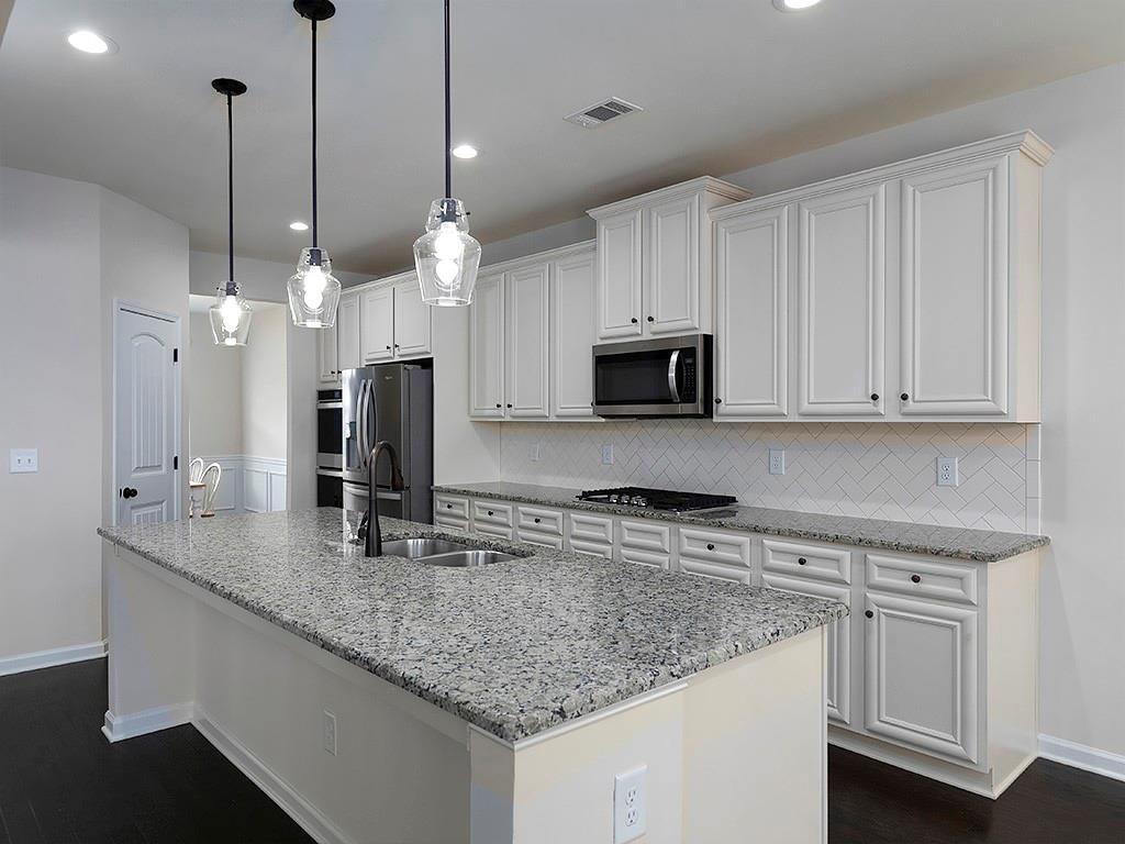 488 Victoria Heights Dr. Dallas, GA 30132 - Photo 6 of 45 a kitchen with stainless steel appliances granite countertop a sink a oven and a white cabinets