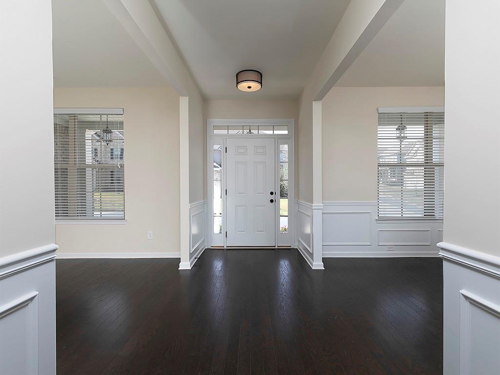 488 Victoria Heights Dr. Dallas, GA 30132 - Photo 9 of 45 an empty room with wooden floor and windows