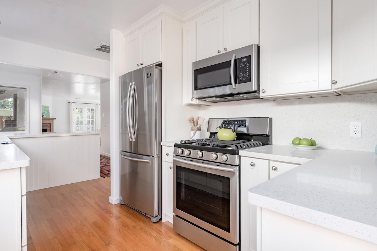 2891 Scriver Street Santa Cruz, CA 95062 - Photo 12 of 30 a kitchen with stainless steel appliances a stove a microwave and a hard wood floors