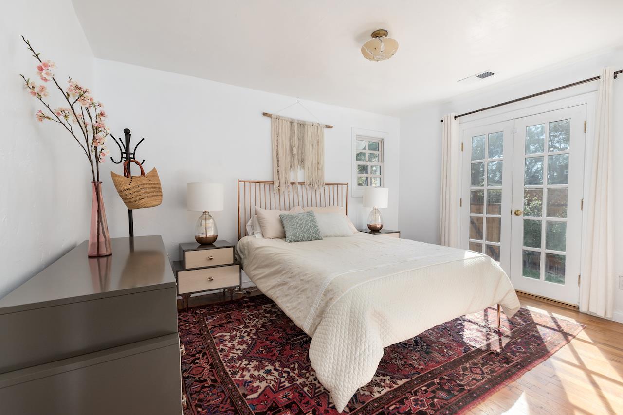 2891 Scriver Street Santa Cruz, CA 95062 - Photo 14 of 30 a bedroom with a bed mirror and a window