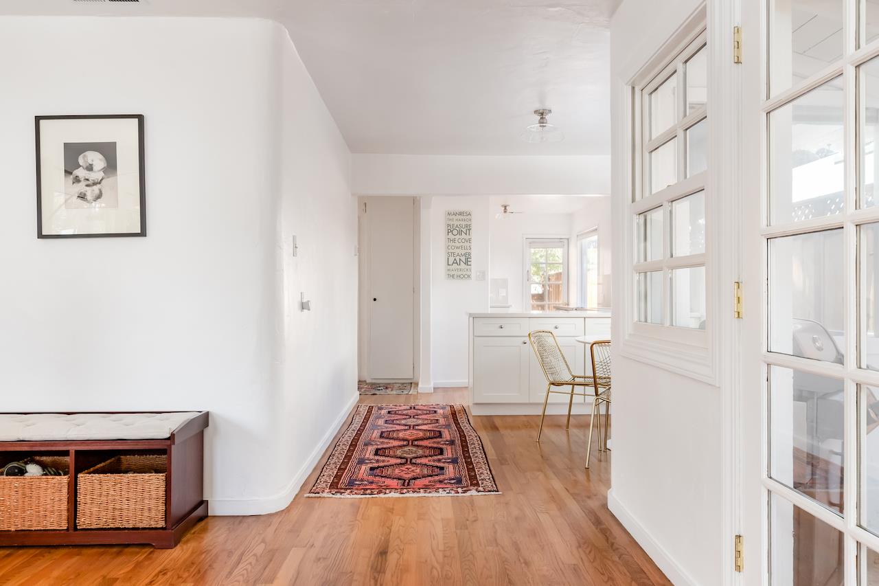 2891 Scriver Street Santa Cruz, CA 95062 - Photo 7 of 30 a view of a hallway with furniture and wooden floor
