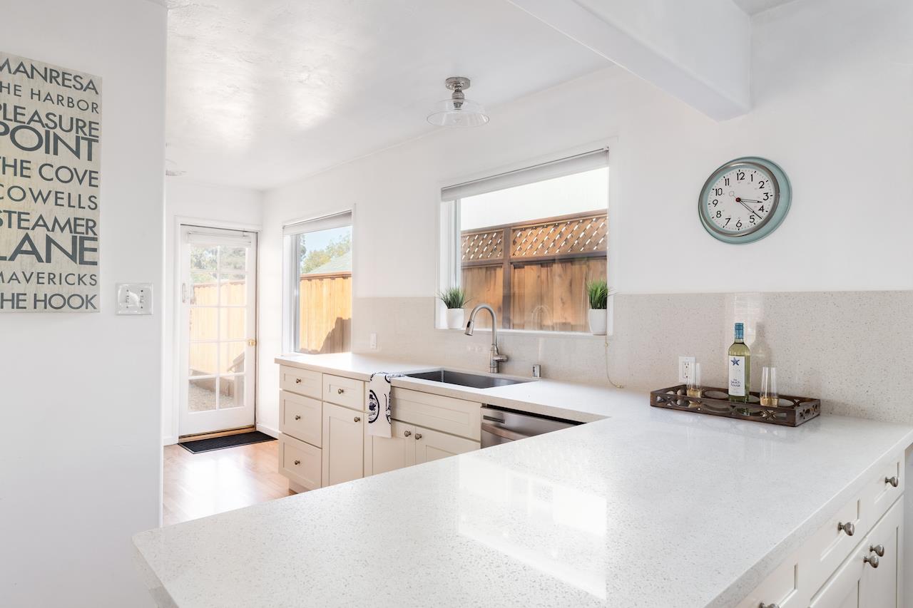 2891 Scriver Street Santa Cruz, CA 95062 - Photo 10 of 30 a large white kitchen with a large window