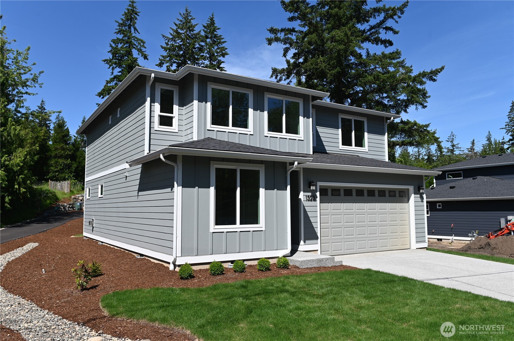 1323 Roland Street Bellingham, WA 98229 - Photo 3 of 16 a front view of a house with a yard and garage
