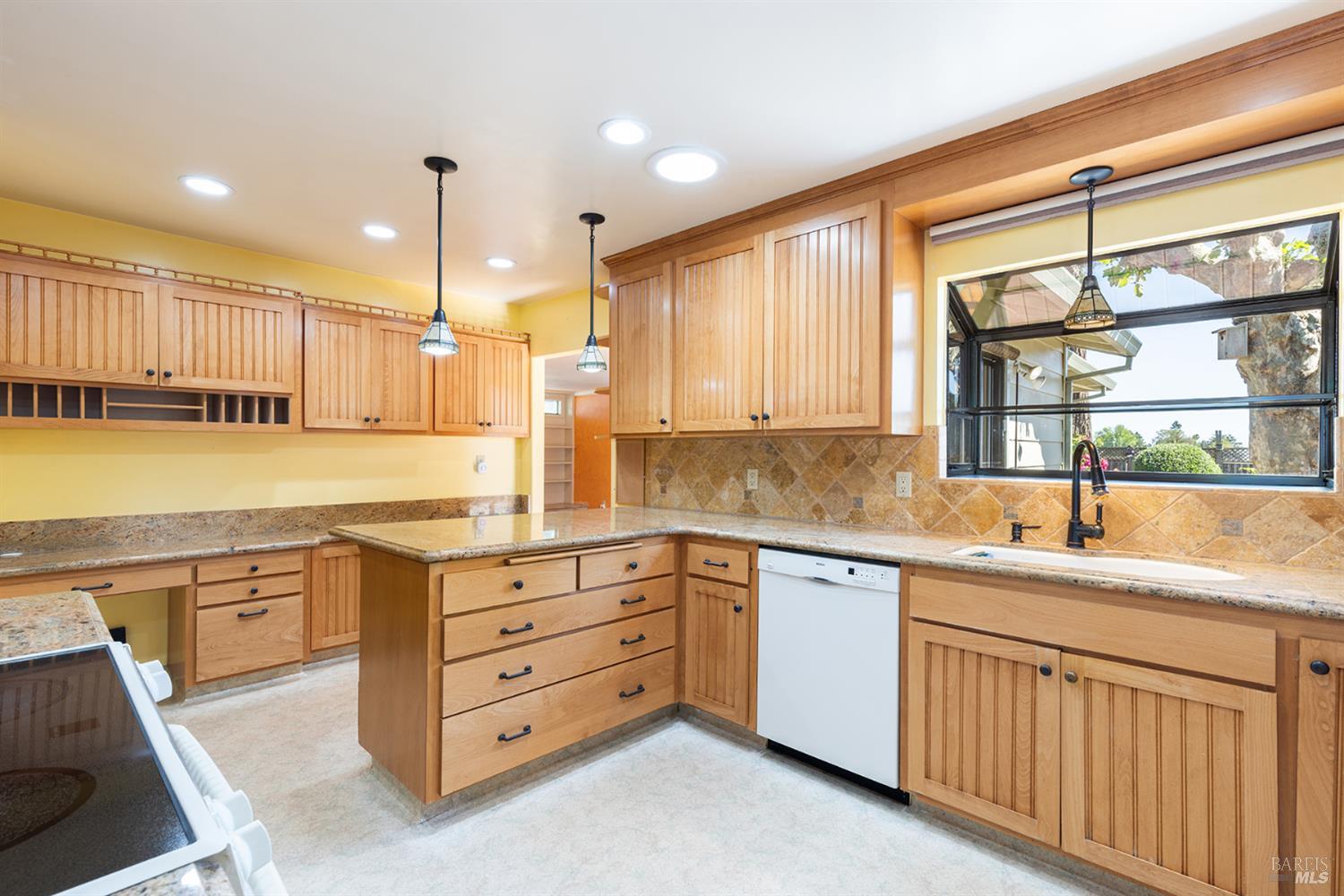 2236 West Hearn Avenue Santa Rosa, CA 95407 - Photo 3 of 56 a kitchen with granite countertop cabinets sink and window