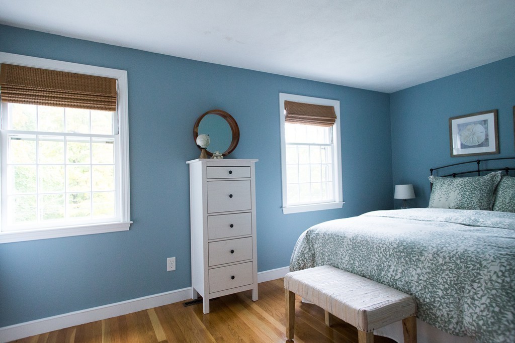 266 Pelham Island Road Wayland, MA 01778 - Photo 18 of 20 a bedroom with a bed and a dresser next to a window