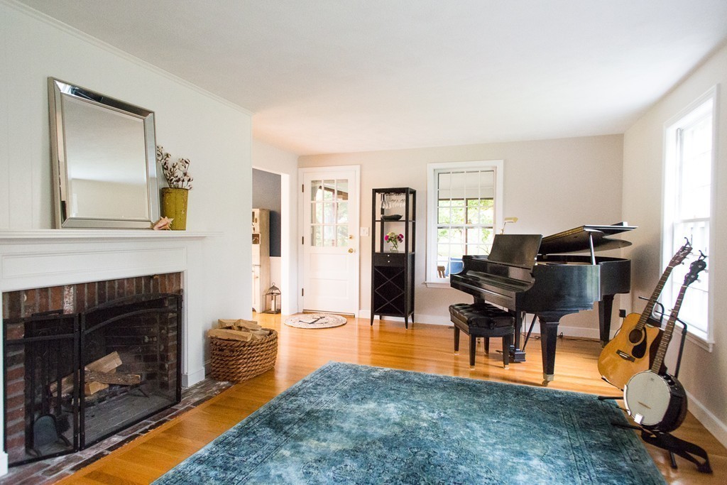 266 Pelham Island Road Wayland, MA 01778 - Photo 5 of 20 a living room with furniture and a fireplace