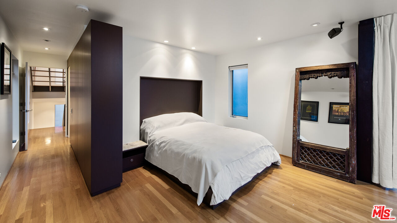110 Topsail Mall Marina del Rey, CA 90292 - Photo 14 of 39 a large bedroom with a bed and wooden floor
