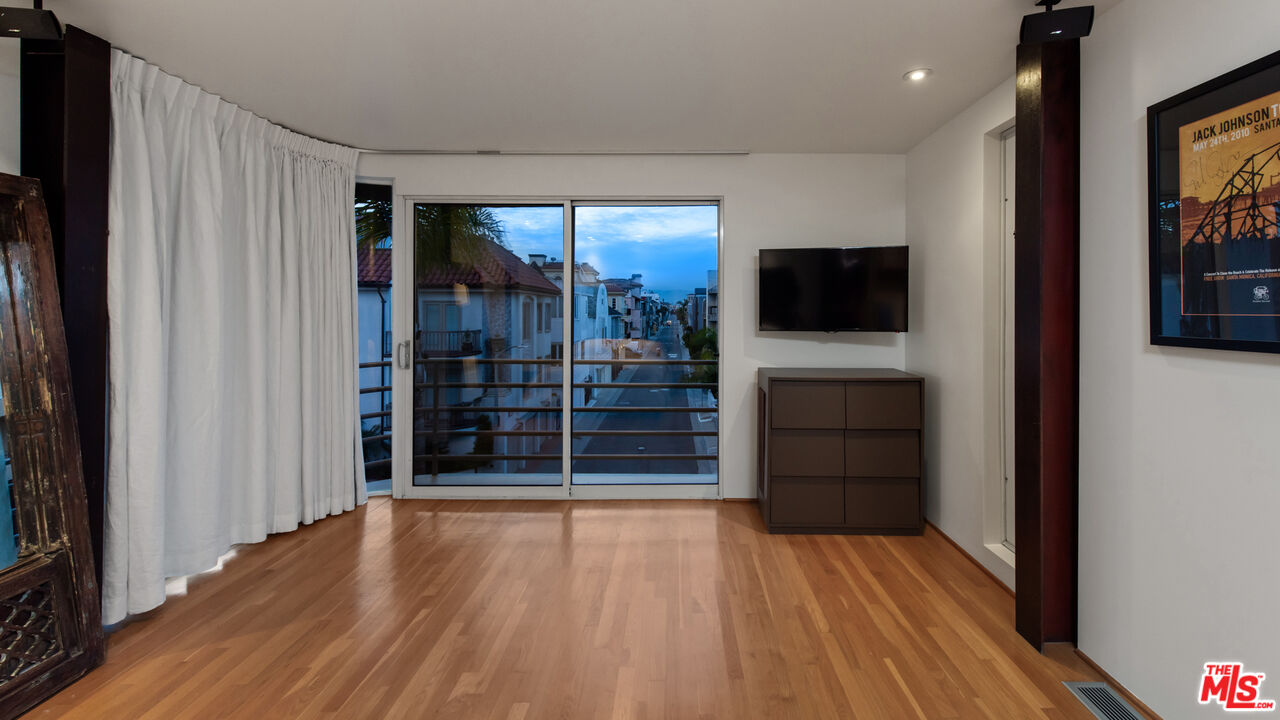 110 Topsail Mall Marina del Rey, CA 90292 - Photo 15 of 39 a view of a livingroom with wooden floor and a flat screen tv