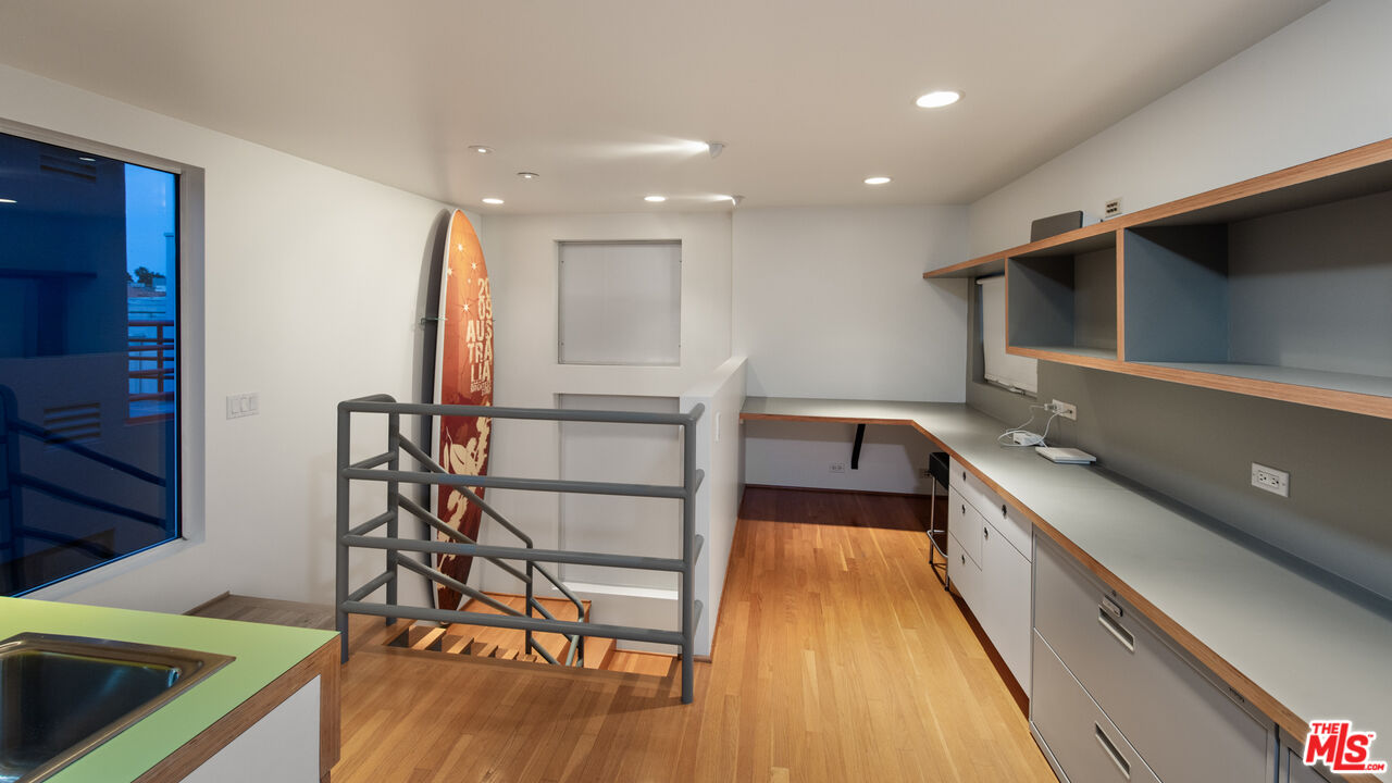 110 Topsail Mall Marina del Rey, CA 90292 - Photo 21 of 39 a kitchen with a sink a counter top space stainless steel appliances and cabinets