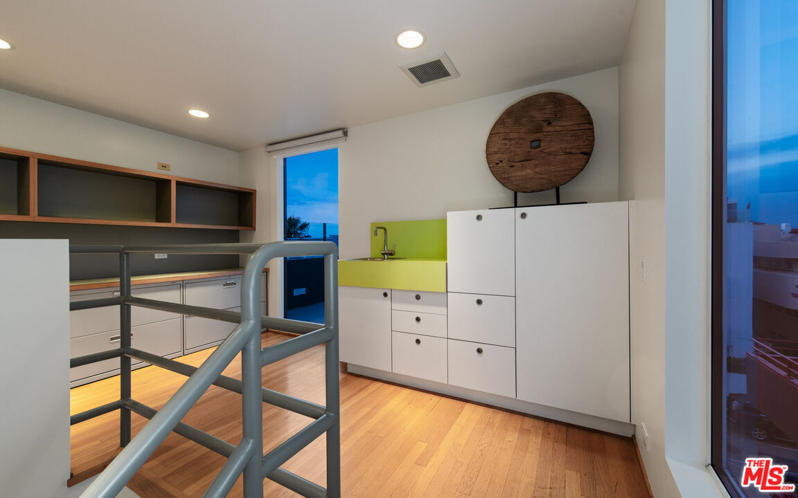 110 Topsail Mall Marina del Rey, CA 90292 - Photo 22 of 39 a kitchen with furniture a clock and a window