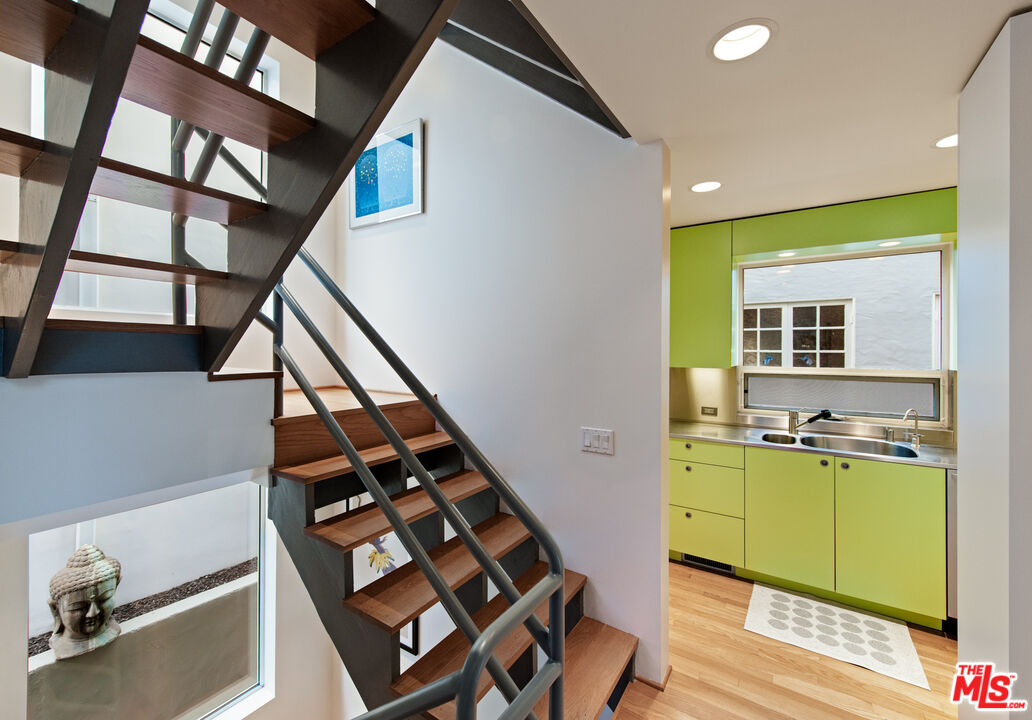 110 Topsail Mall Marina del Rey, CA 90292 - Photo 4 of 39 a view of kitchen and utility room with stairs and furniture