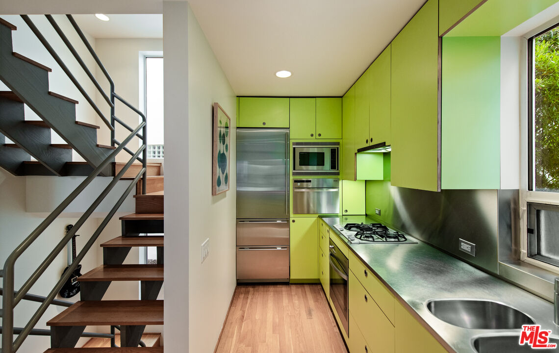 110 Topsail Mall Marina del Rey, CA 90292 - Photo 5 of 39 a kitchen with stainless steel appliances granite countertop a refrigerator and a stove top oven