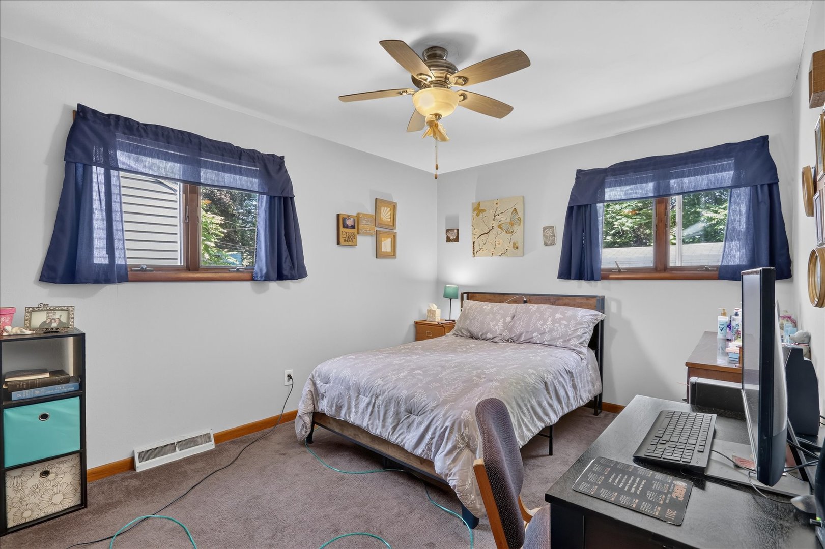 1204 West Violet Street Freeport, IL 61032 - Photo 25 of 36 a bedroom with a bed and a chandelier