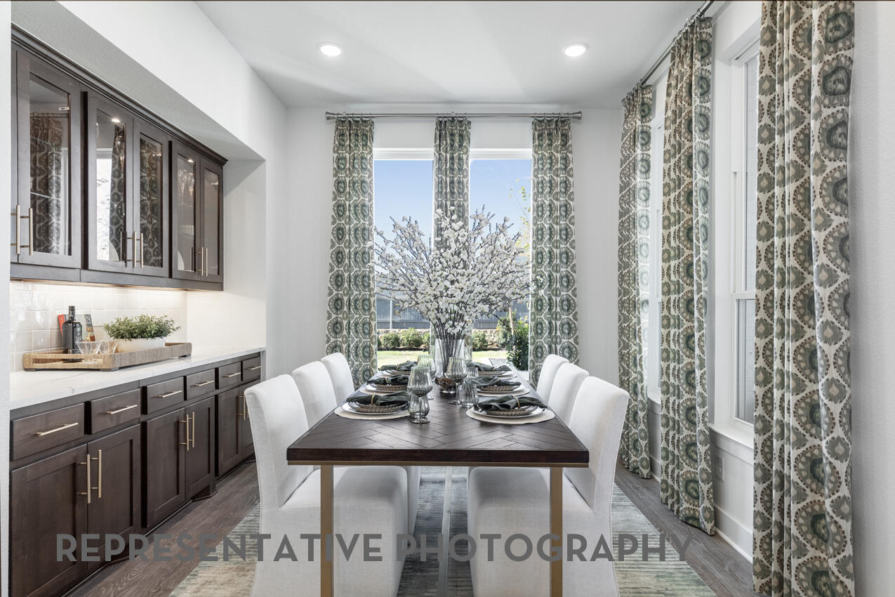 1216 Wolf Cyn Road Georgetown, TX 78628 - Photo 32 of 39 a view of a dining room with furniture