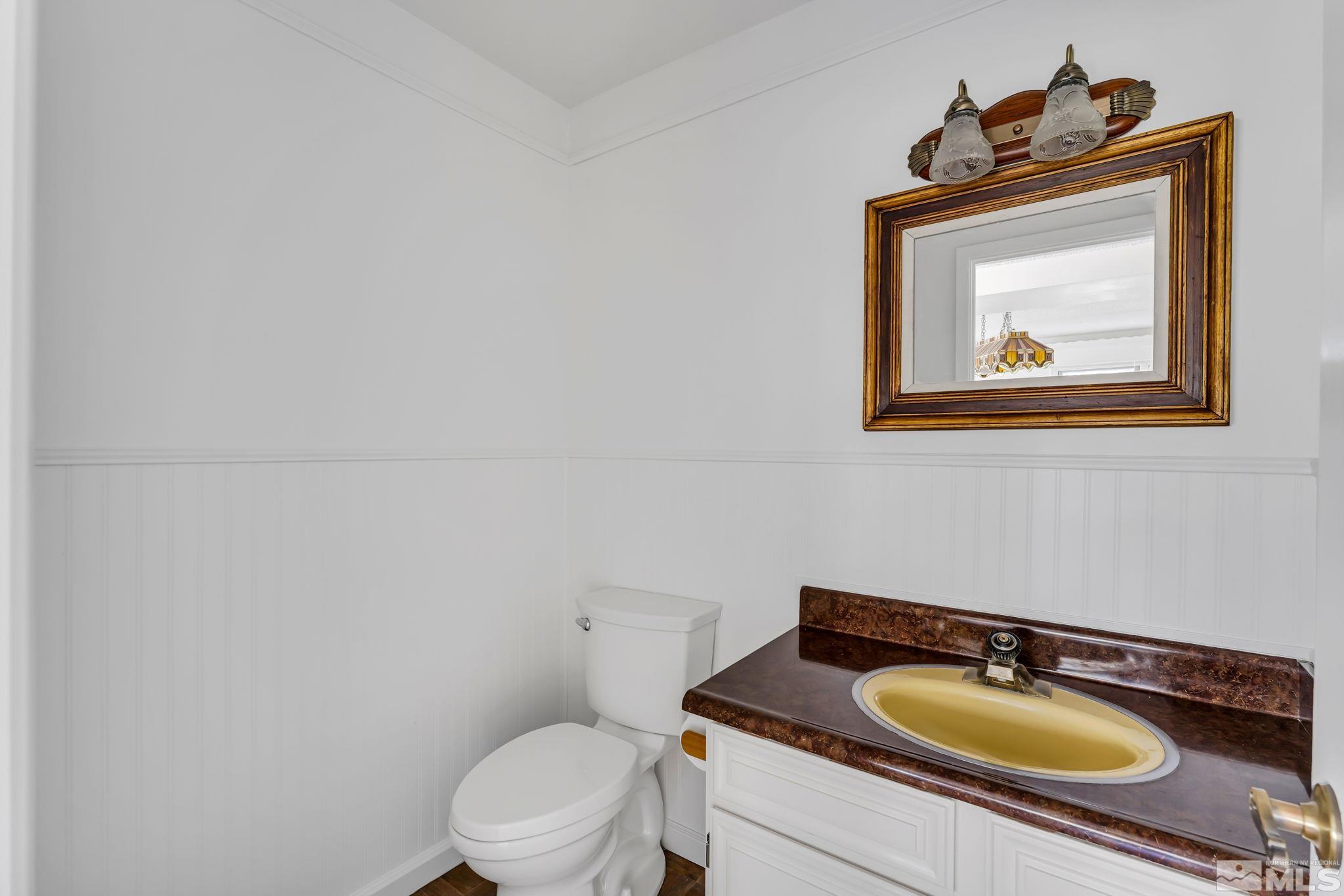 213 Chimney Rock Road Stateline, NV 89449 - Photo 26 of 37 a bathroom with a toilet sink and mirror