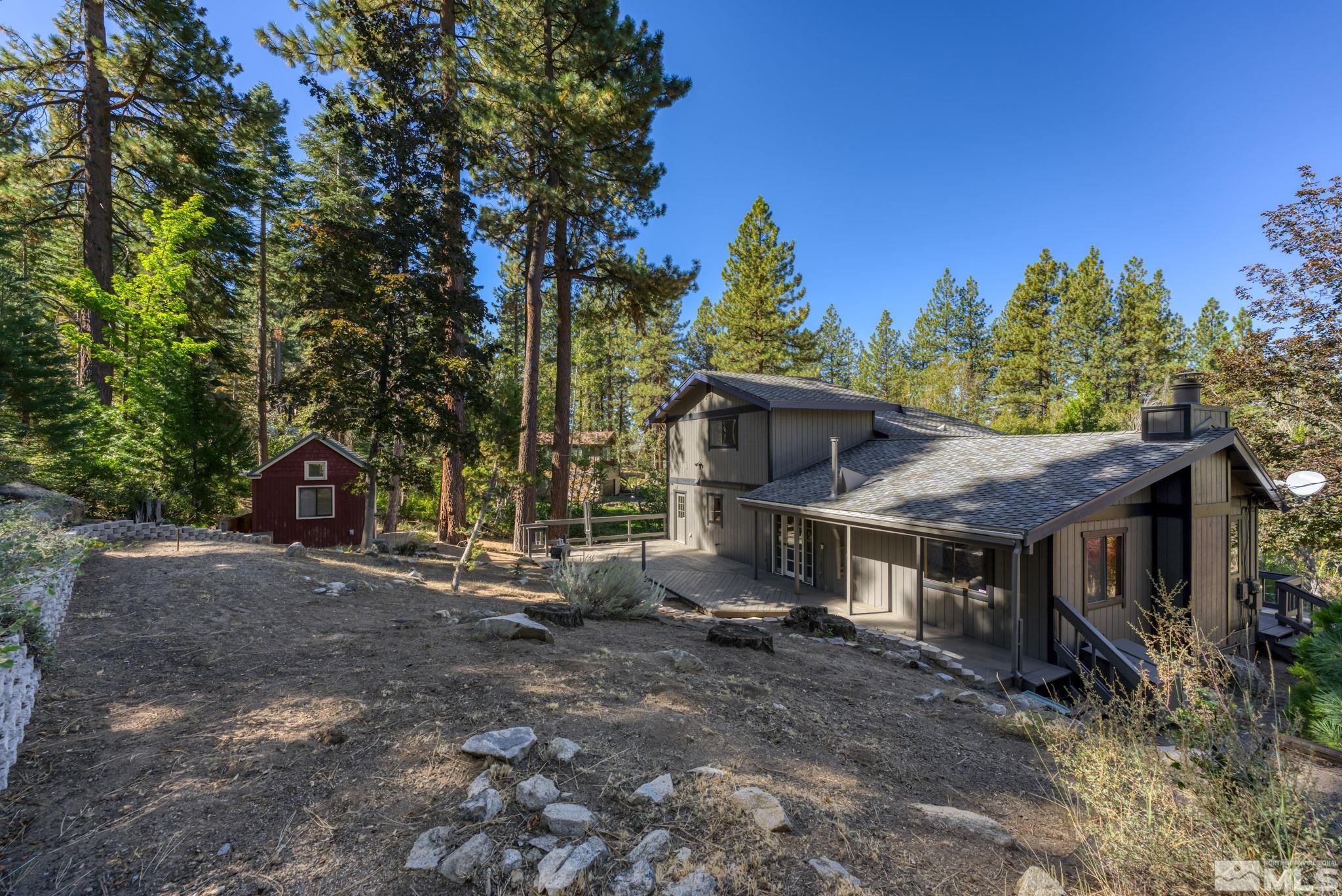 213 Chimney Rock Road Stateline, NV 89449 - Photo 9 of 37 a view of a house with a yard and tree