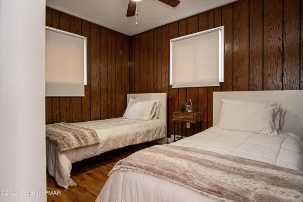 a bedroom with a bed and a fireplace