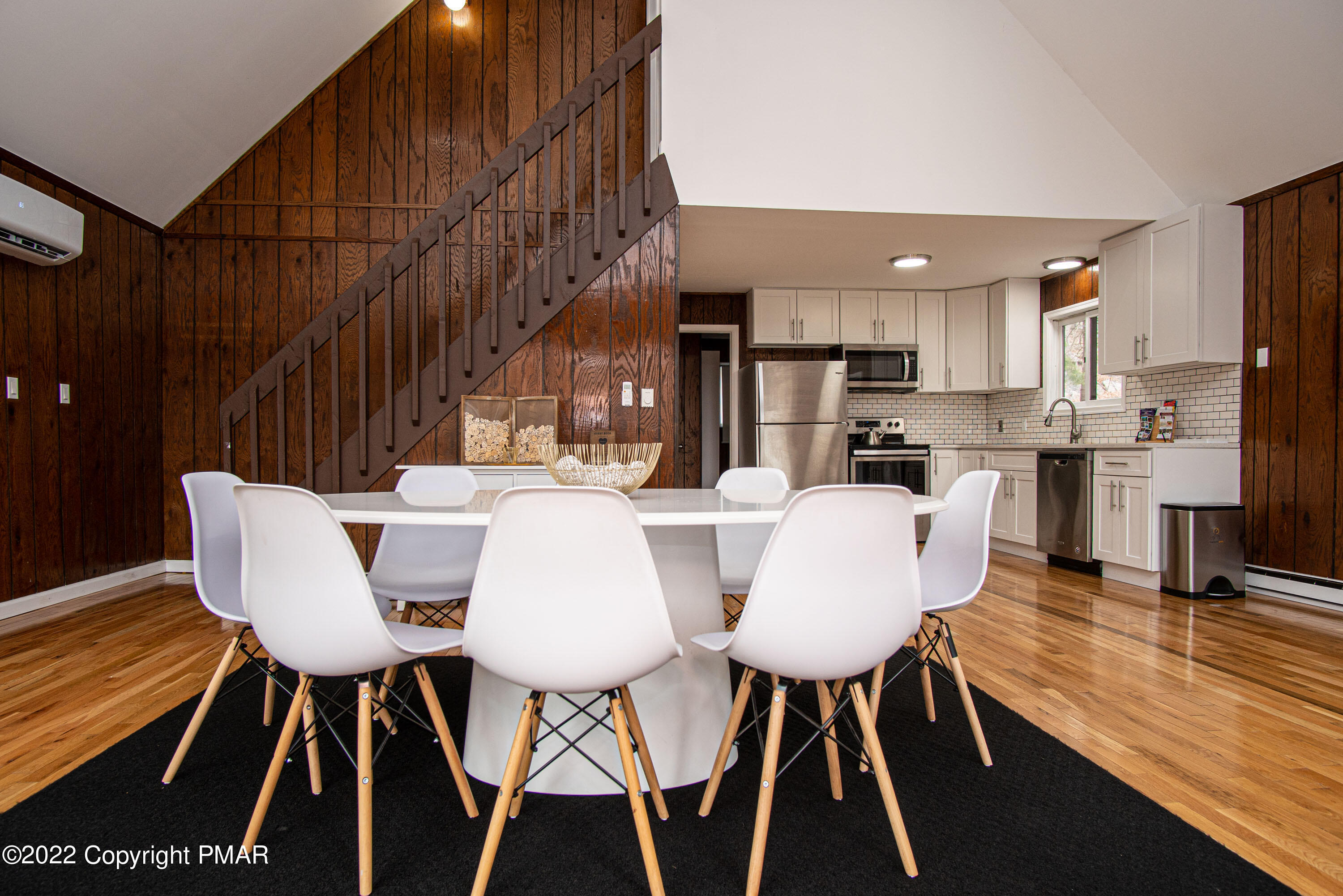 125 Edinburgh Road Bushkill, PA 18324 - Photo 19 of 64 a view of a dining room with furniture and wooden floor