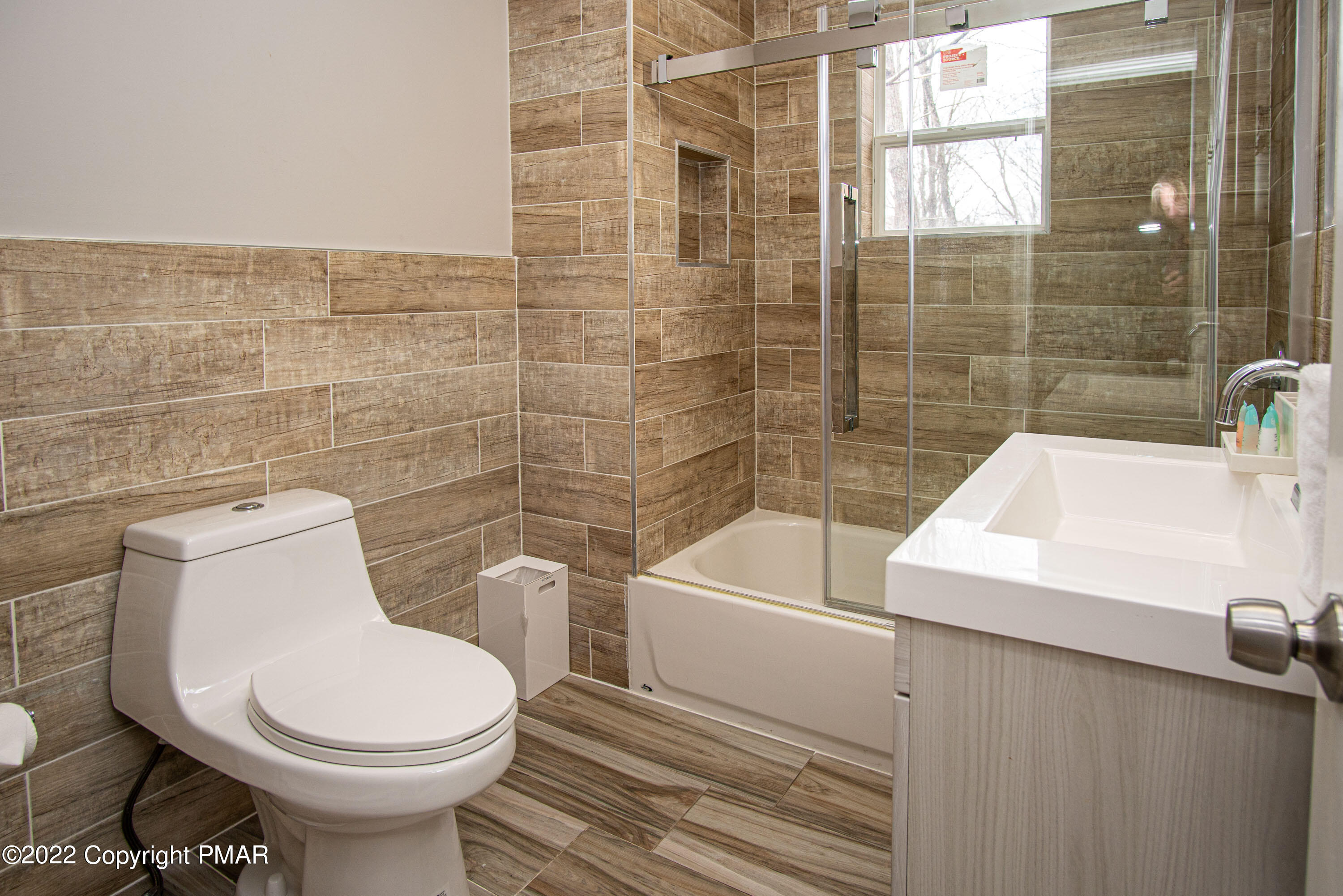 125 Edinburgh Road Bushkill, PA 18324 - Photo 25 of 64 a white toilet sitting next to a bathroom sink