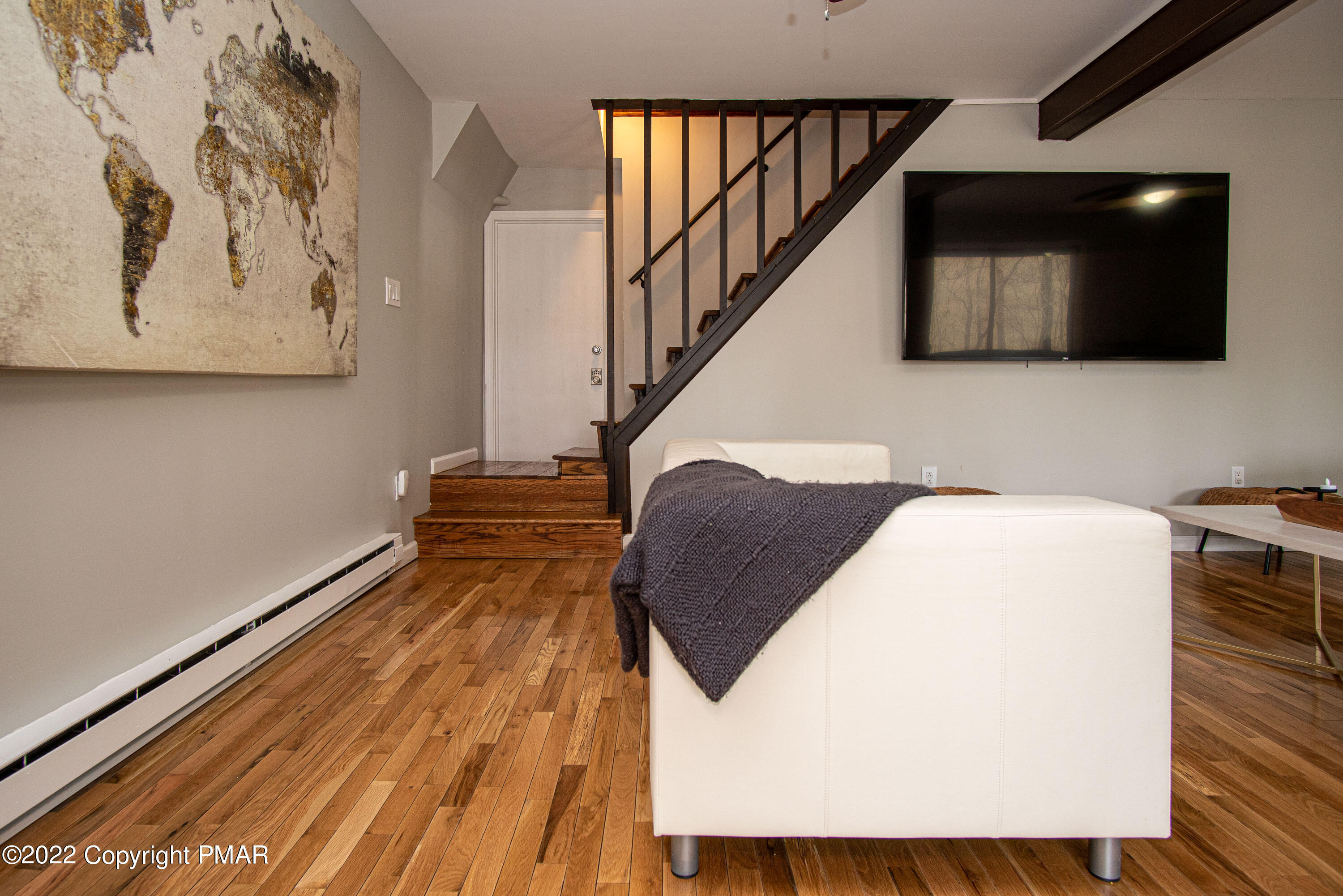 125 Edinburgh Road Bushkill, PA 18324 - Photo 31 of 64 a view of a livingroom with wooden floor and stairs
