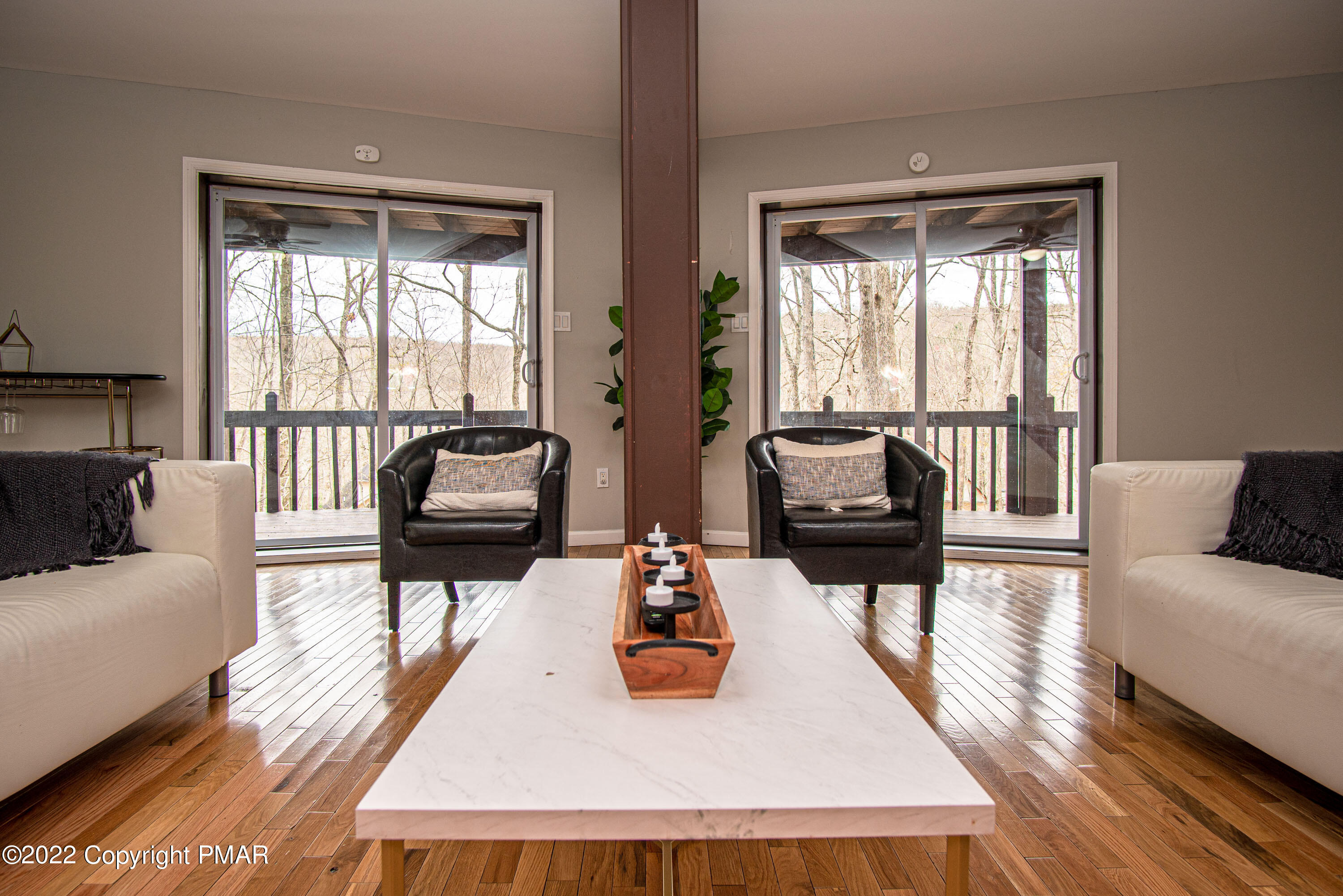 125 Edinburgh Road Bushkill, PA 18324 - Photo 32 of 64 a living room with furniture and a large window