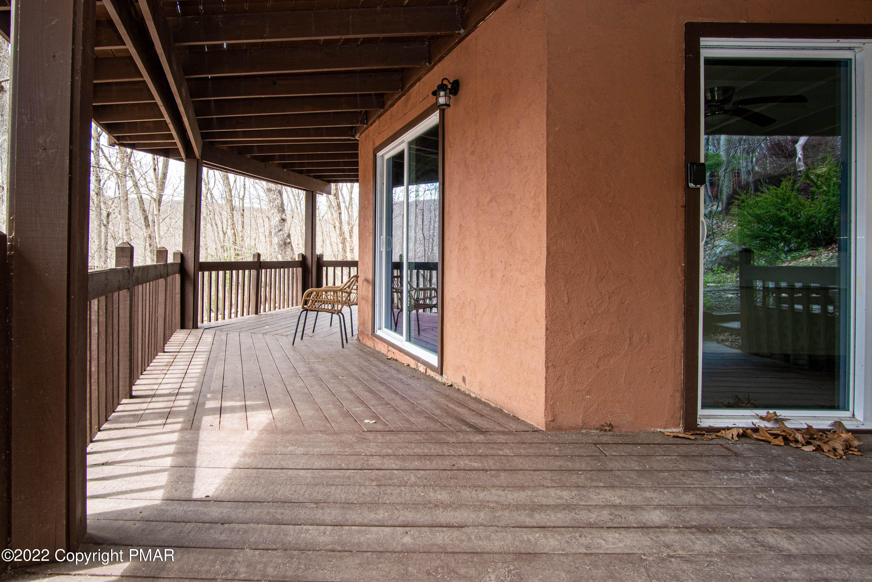 125 Edinburgh Road Bushkill, PA 18324 - Photo 36 of 64 a view of backyard with large window and wooden floor