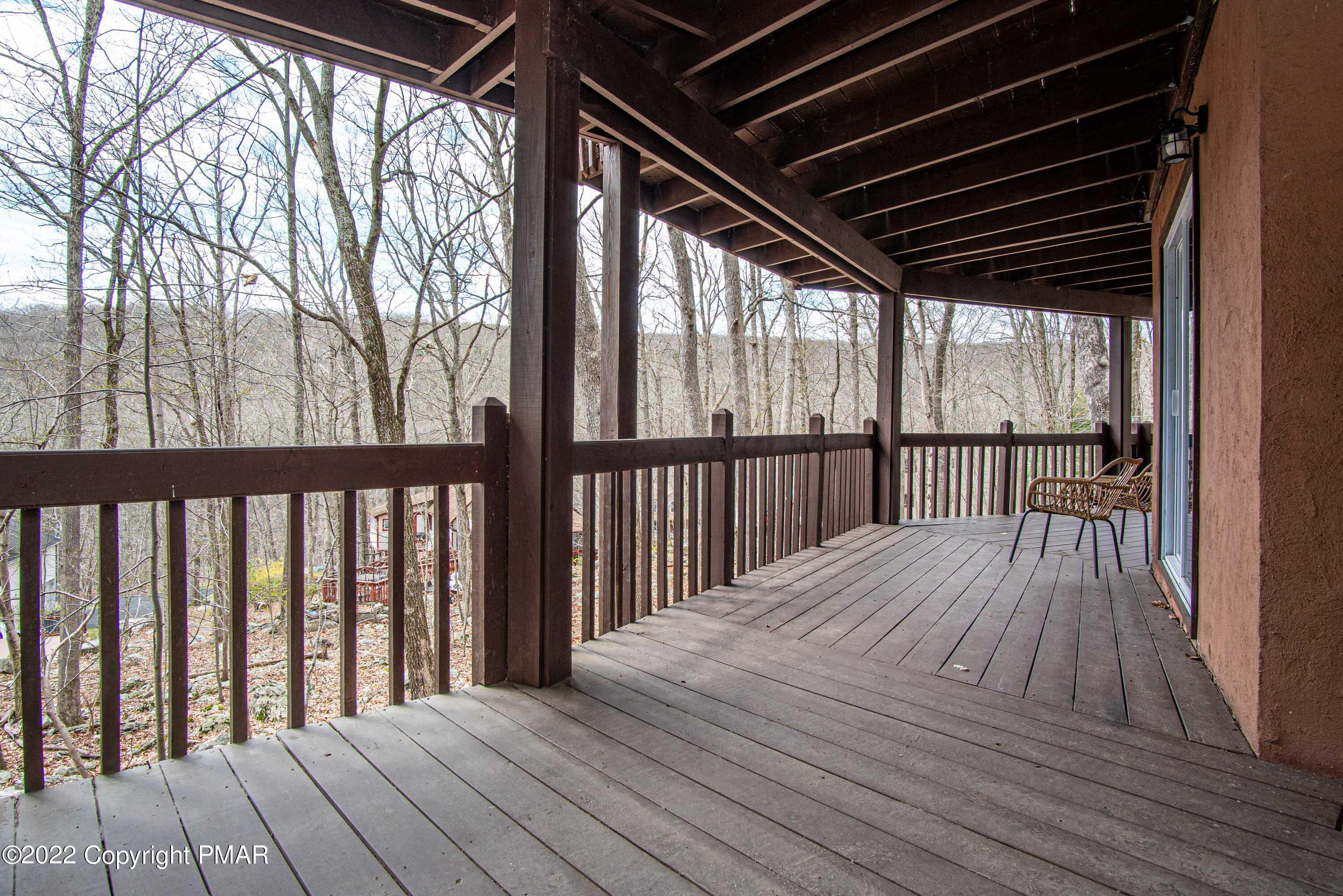 125 Edinburgh Road Bushkill, PA 18324 - Photo 37 of 64 a view of backyard with a deck and wooden floor