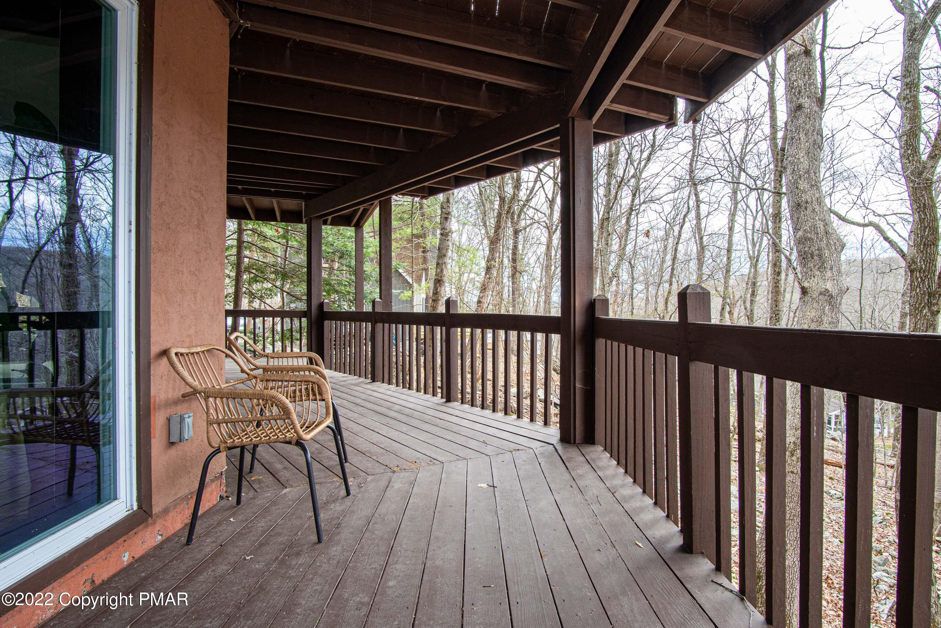 125 Edinburgh Road Bushkill, PA 18324 - Photo 38 of 64 a view of balcony with wooden floor and outdoor seating