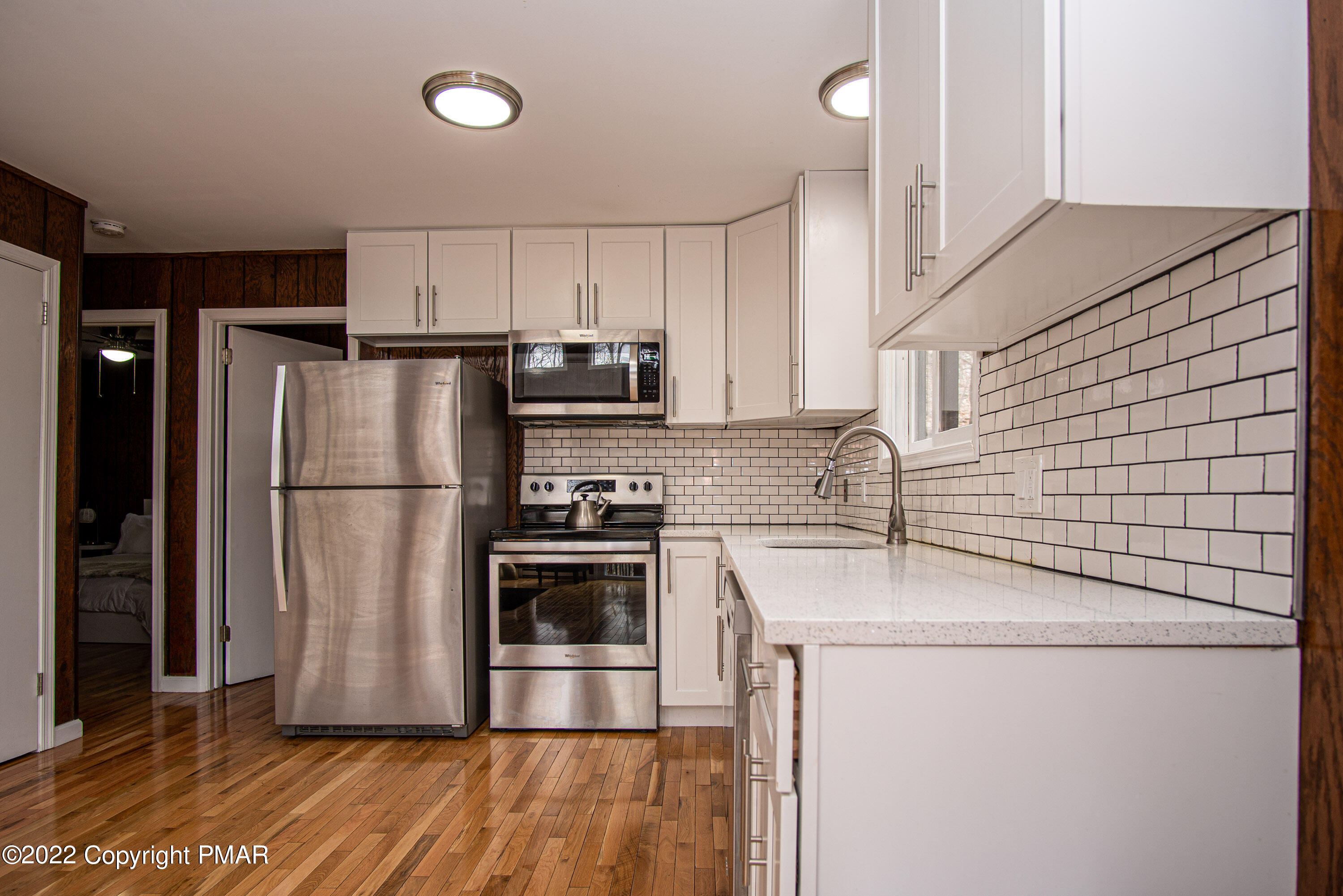 125 Edinburgh Road Bushkill, PA 18324 - Photo 10 of 64 a kitchen with stainless steel appliances a refrigerator sink and microwave