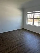 a kitchen with white cabinets and sink