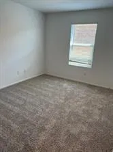 a bathroom with a bathtub and a toilet